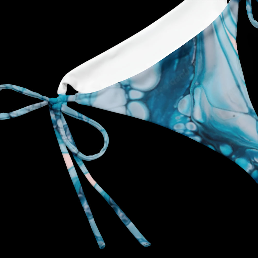 Did someone say sunbathing time? This summer, sit back and relax by the poolside wearing this versatile, String Bikini Bottom. Enjoy the soft, stretchy recycled polyester piece with UPF & nbsp; 50+ and straps you can tighten for a better fit! • Flexible bikini straps • Soft and stretchy material with UPF & nbsp; 50+