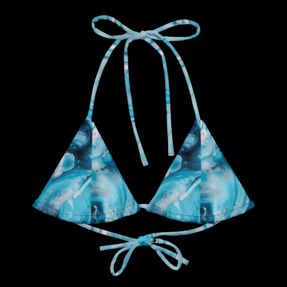 Get ready for the summer season with this eco-friendly All-Over Print Recycled Padded String Bikini Top. The top is made from soft recycled polyester, with UPF 50+ and versatile, stretchy straps ready for styling. Grab one today and pair it with a swim-ready outfit. • Flexible and adjustable straps • Soft and stretchy material with UPF 50+ • Removable padding for comfort • Multiple ways to tie and style